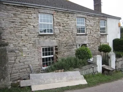 This former coach house over the years has had various works undertaken by various builders but done with cement render.